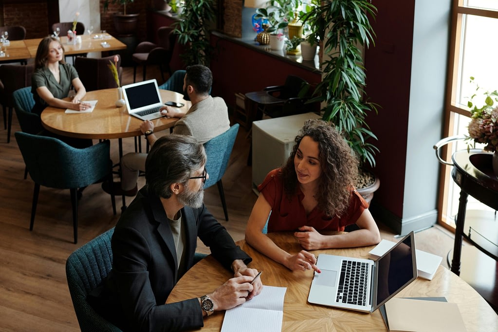 Business team reviewing financial gap analysis report in boardroom