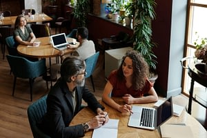 Business team reviewing financial gap analysis report in boardroom