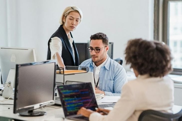 Investors reviewing financial reports during fundraising discussions
